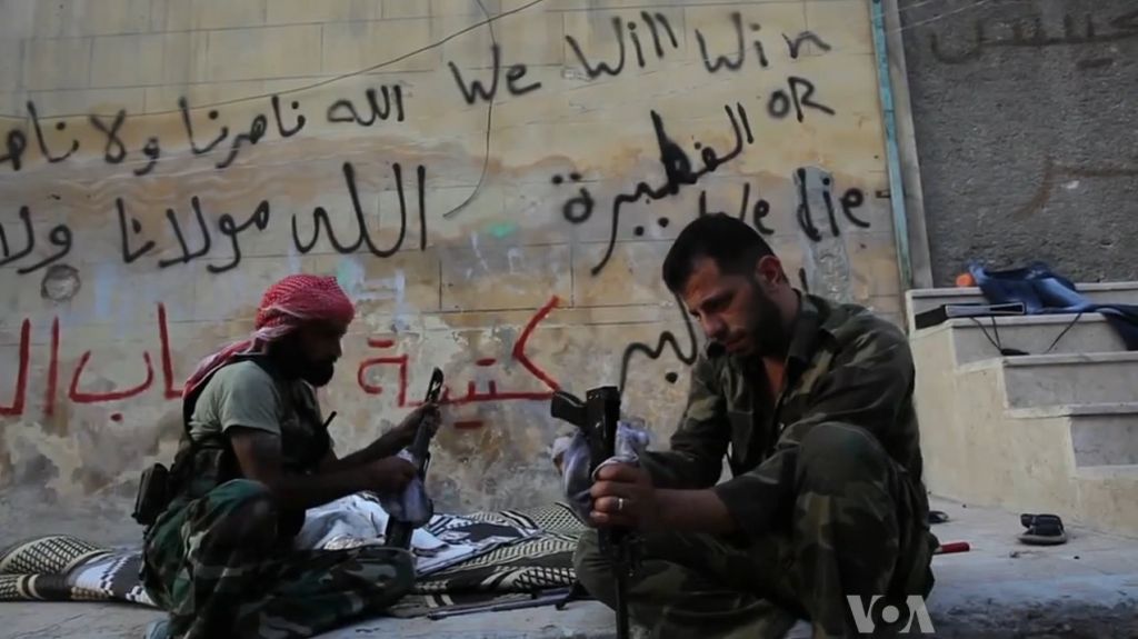 FSA_rebels_cleaning_their_AK47s